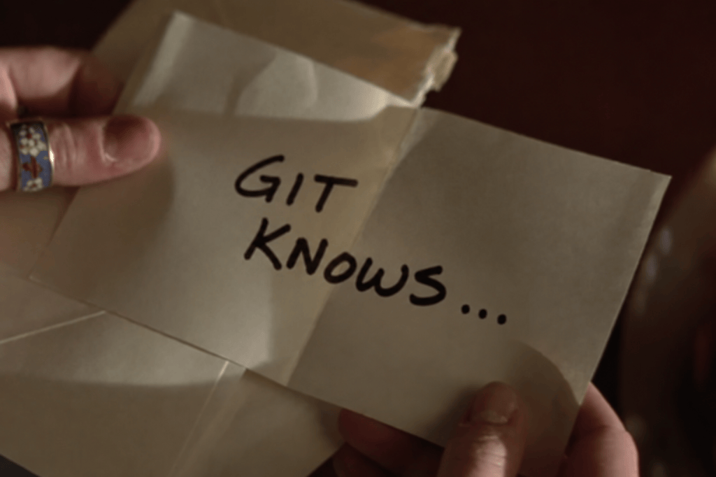 A hand holding a piece of paper with the words 'GIT KNOWS...' written in bold letters.